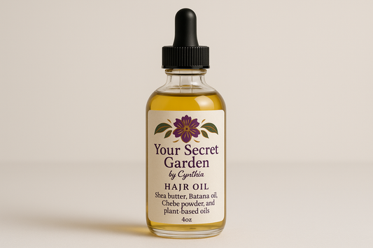 Please create a 4oz clear bottle  black eye dropper  Please use the afrrican flower  purpleand gold logo with green leaves   Please use the label Your Secret Garden by Cynthia The hair oil includes Sheabutter  Batana oil Chebe powder and plant based oils 